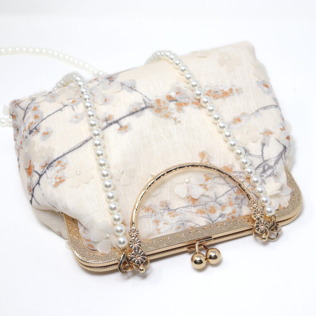 Cream clutch bag